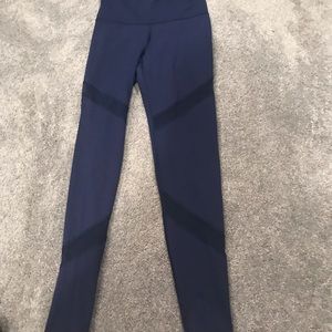Navy athletic pants with mesh cut outs